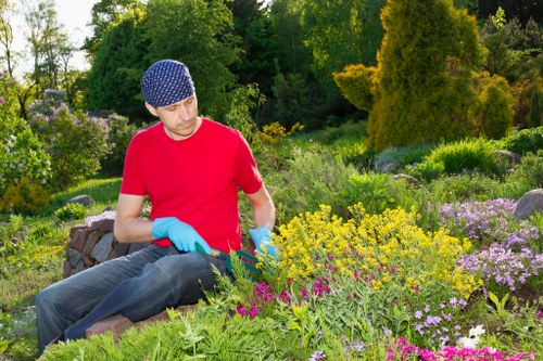 Professional gardeners improving an urban garden space in Gospel Oak